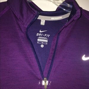 Woman’s purple dri fit Nike athletic top